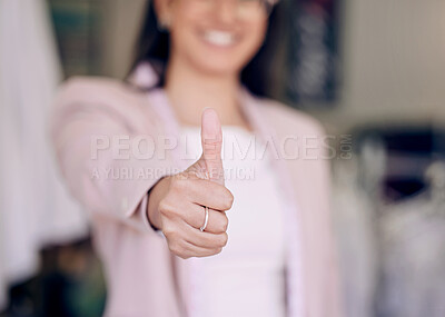 Buy stock photo Shot of a seamstress giving thumbs up while working in her boutique