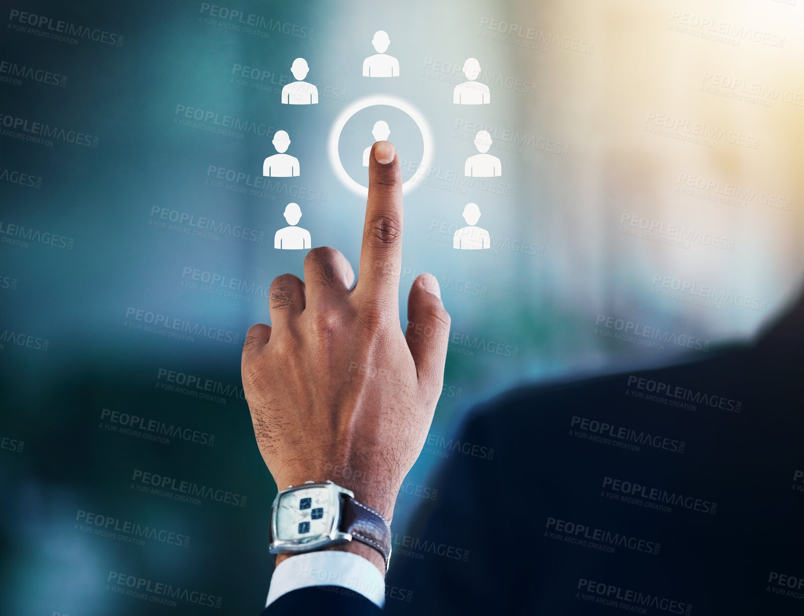 Buy stock photo Cropped shot of an unrecognisable businessman standing alone in the office and selecting a candidate