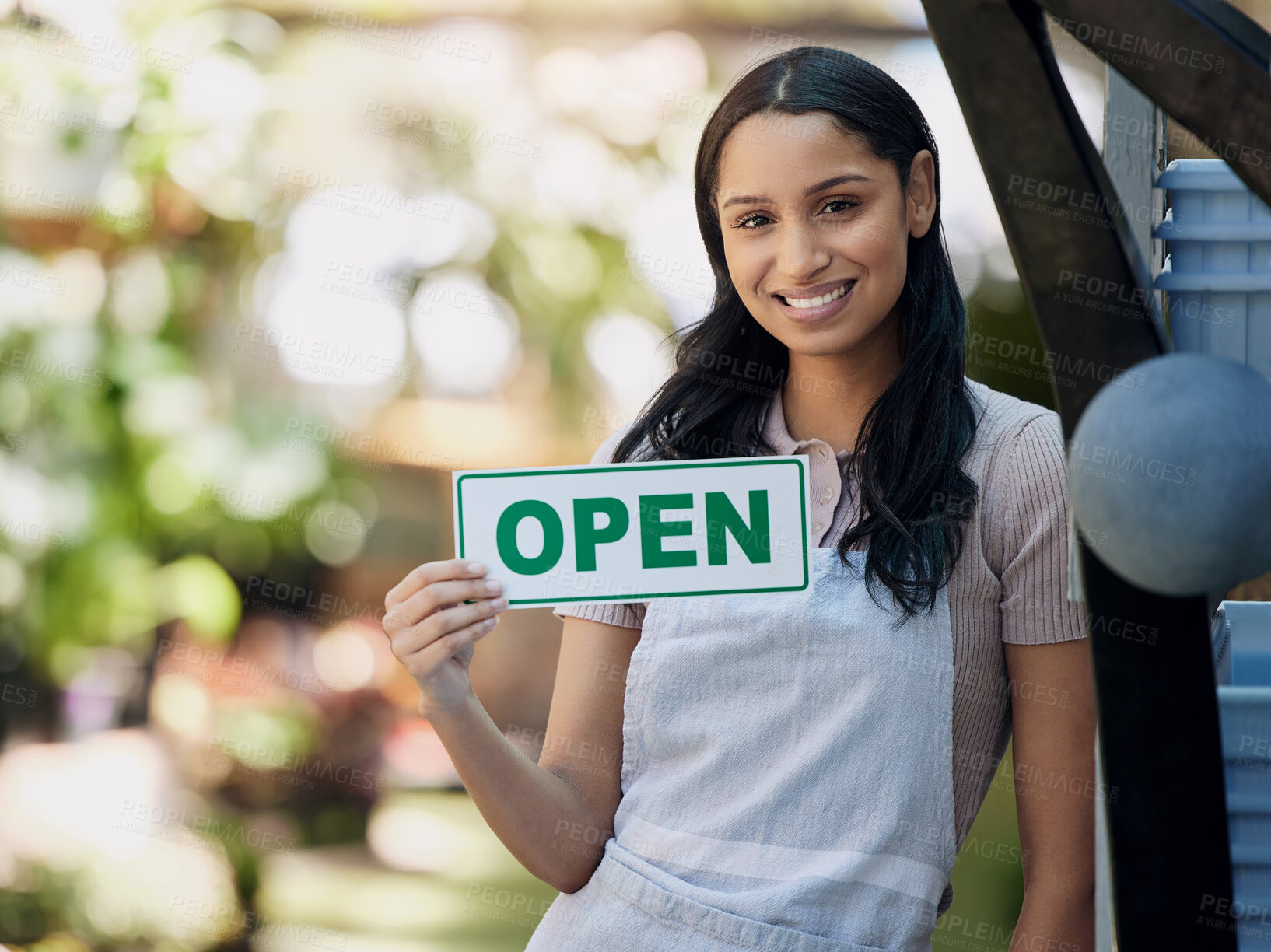 Buy stock photo Woman, smile and open sign at nursery with small business, gardening and sustainability with welcome. Poster, notice and portrait of flower seller with retail, florist or entrepreneur with service