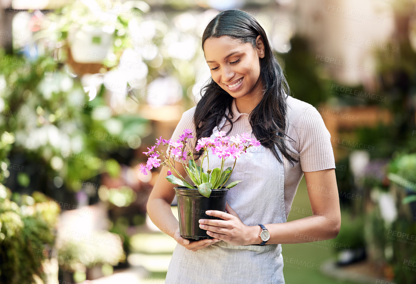 Buy stock photo Woman, happy and thinking of flowers in garden for sustainable, plant and ecology in outdoor store. Florist, female business owner and inventory in nursery for career, clean energy and eco friendly