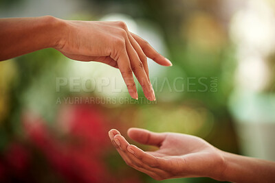 Buy stock photo Hands, love and people with a reaching gesture in an outdoor green garden or park in nature. Connection, romantic and closeup zoom of a couple for support, romance or touch together outside.