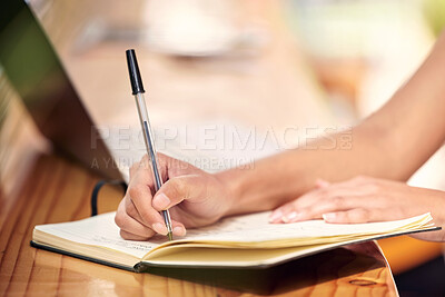 Buy stock photo Shot of a nursery owner using a laptop and making notes