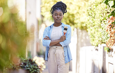 Buy stock photo Portrait, painter and confident black woman with brush for design, diy or maintenance repair. Arms crossed, paint tools and serious person outdoor for renovation, remodeling or decoration in Nigeria