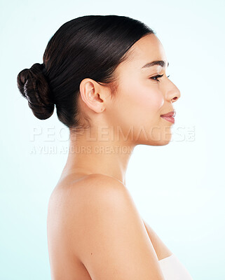 Buy stock photo Beauty, natural and profile of woman in studio on blue background for cosmetics or dermatology. Face, skincare and vitamin c with confident model at spa for collagen, health or wellness treatment