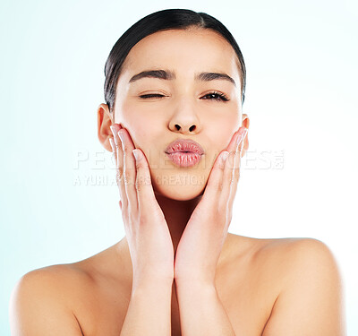 Buy stock photo Studio portrait of an attractive young woman posing against a light background