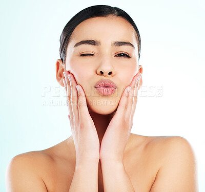 Buy stock photo Beauty, kiss and wink with portrait of woman in studio on white background for cosmetics or dermatology. Face, pout and skincare with model flirting at spa for collagen, health or wellness treatment