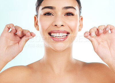 Buy stock photo Portrait, floss and woman in studio, routine and cleaning of teeth for oral health, dental and smile. White background, hygiene and washing of tooth, maintenance and happy for gums and treatment