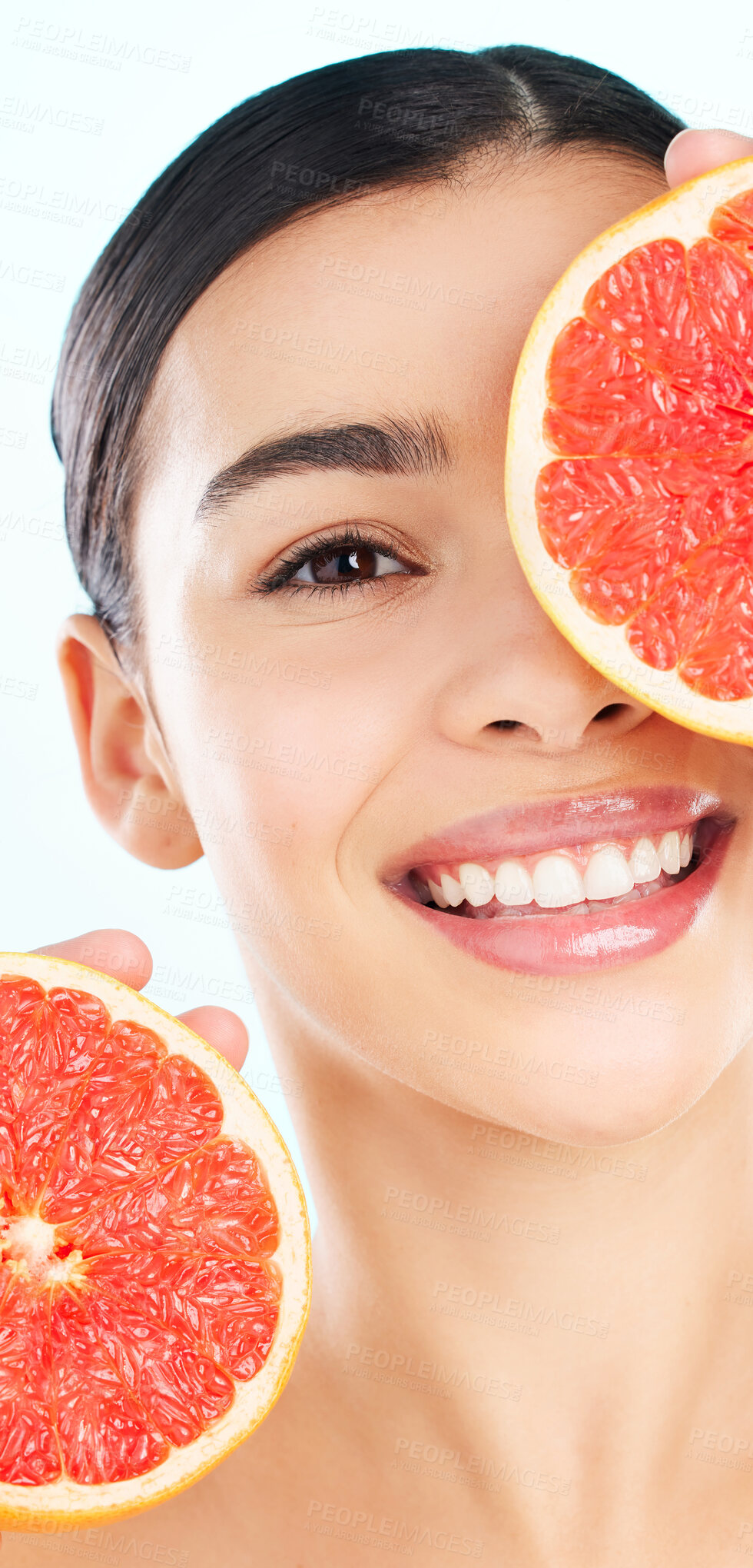 Buy stock photo Beauty portrait, happy woman and grapefruit for skincare with glow, diet and health in studio. Female person, smile and vitamin c fruit for dermatology, inflammation and nutrition by white background