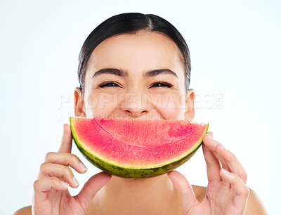 Buy stock photo Studio portrait of an attractive young woman posing with a watermelon against a light background