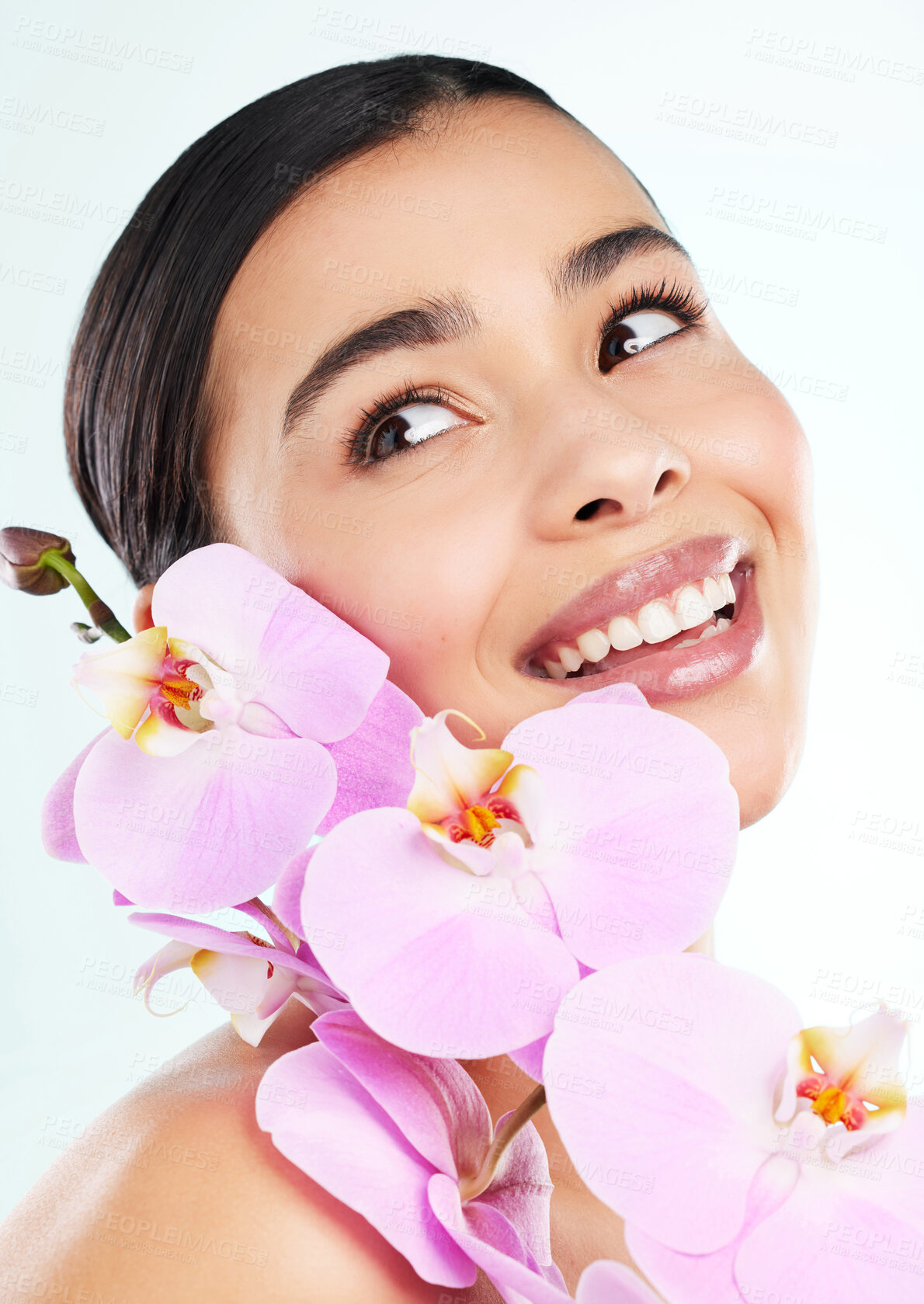 Buy stock photo Beauty, happy woman and orchid for skincare in studio with sustainability, healthy glow and organic facial. Girl, smile and flower for eco cosmetics, skin inflammation and plant by white background