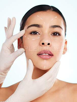 Buy stock photo Studio portrait of an attractive young woman having some plastic surgery done against a light background