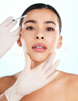 Buy stock photo Studio portrait of an attractive young woman having some plastic surgery done against a light background