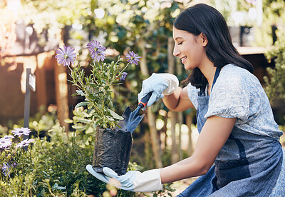 Buy stock photo Woman, smile and plants with shovel for gardening at store in startup with passion for nature with relax. Florist, green and shop with purple daisy for selling in spring for growth with happiness