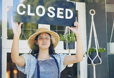 Buy stock photo Closed, floral and woman with sign, recession and inflation with bankruptcy, unemployment or failure. Person, entrepreneur or worker with poster, stagflation or stress with store, emotion or business