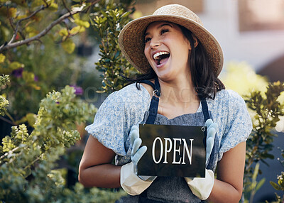 Buy stock photo Happy, nursery and open with a woman holding a sign outside of shop for gardening or landscaping. Small business, garden center and an excited young female entrepreneur opening her new floral store