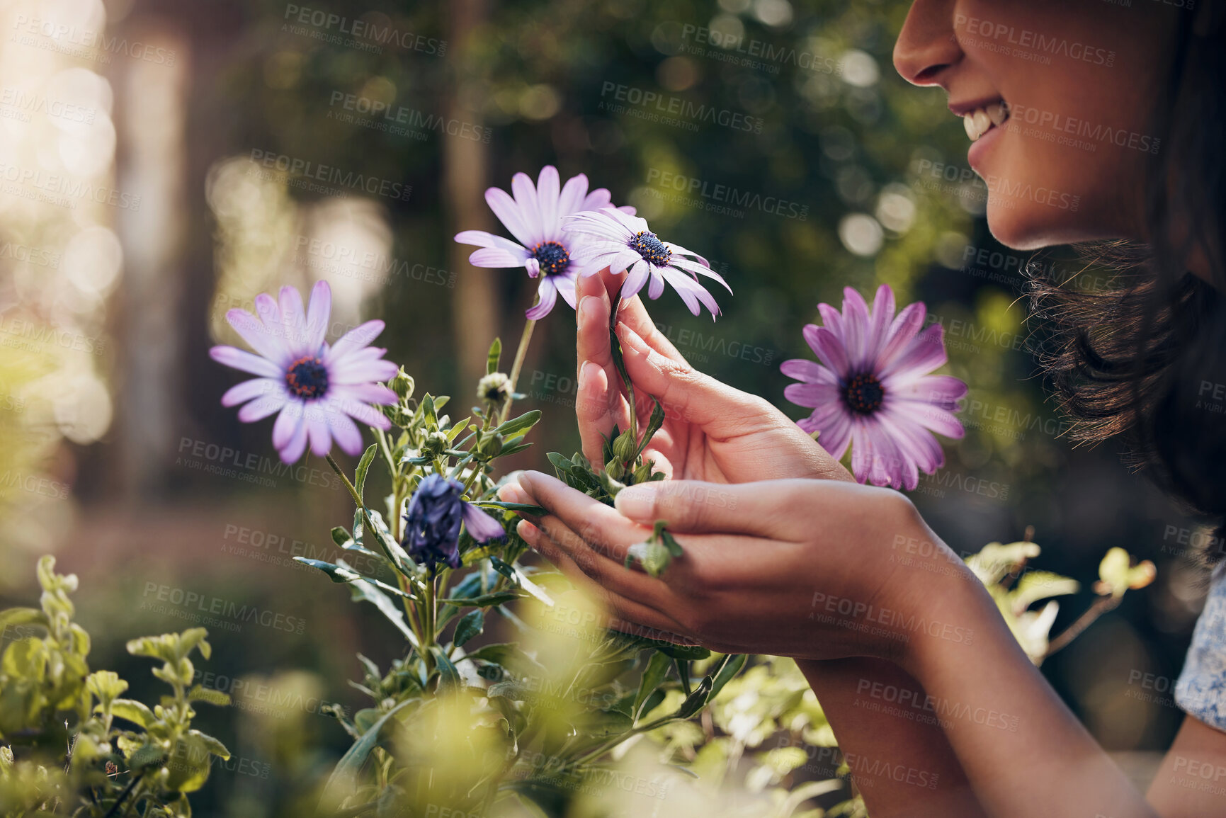 Buy stock photo Closeup, flowers and woman with plants in nursery, smelling and sunshine with smile, spring and nature. Person, outdoor and girl in garden, florist and happy with summer, growth and sustainability