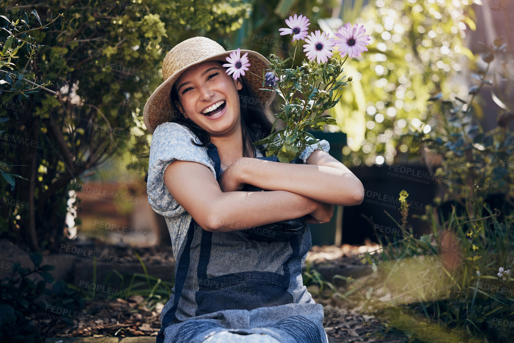 Buy stock photo Florist woman, garden and flowers in nursery, smile and hug plant with excited face for sustainable small business. Girl, entrepreneur and love for plants, growth and nature with happiness in spring