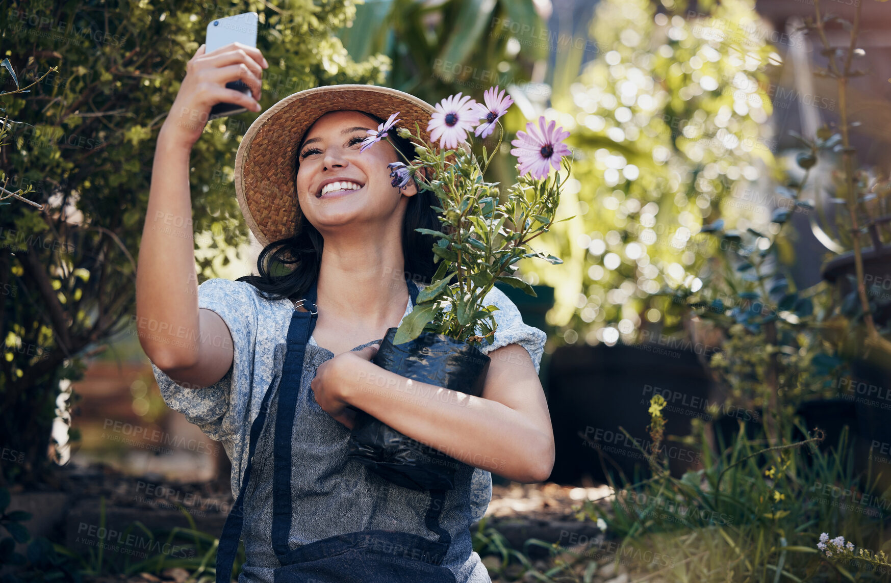 Buy stock photo Florist woman, garden and selfie in nursery, smile and hug plant with excited face for sustainable small business. Girl, entrepreneur and love for plants, growth and nature with post for social media