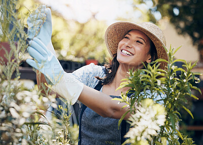 Buy stock photo Smile, gardening and woman checking flowers for botany, growth or development in nature. Botanist, sustainable and female florist with natural floral plants for inspection in eco friendly environment