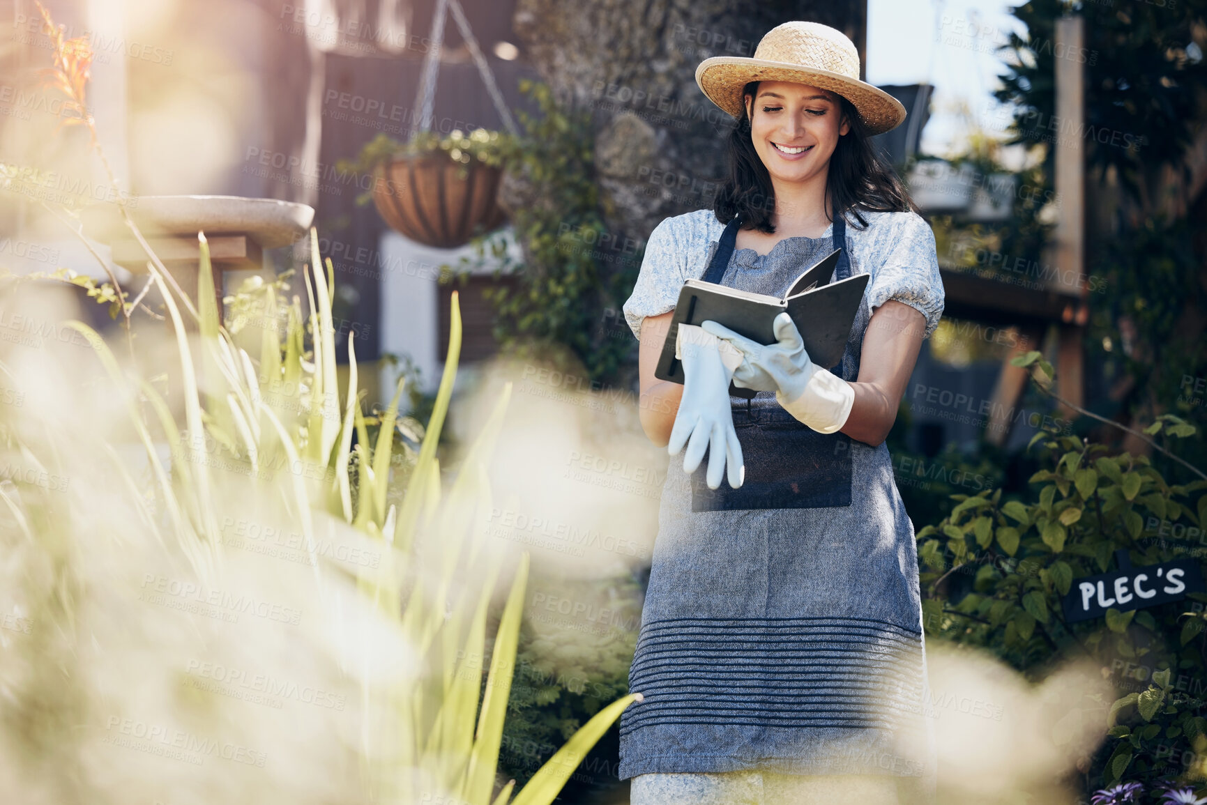 Buy stock photo Writing, florist and woman gardening in nature for growth inspection, development and nursery. Notebook, gardener and eco friendly farming checklist for plants, horticulture or floral sustainability