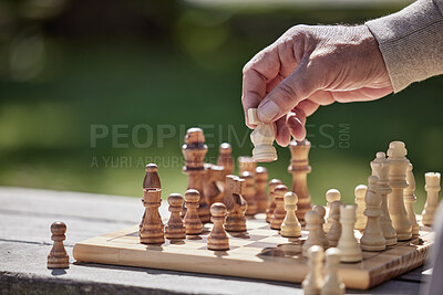 Buy stock photo Hands, man and playing chess game in outdoor with strategy planning, problem solving and choice for competition. Senior person, knight and brain knowledge, battle and learning for sports tournament