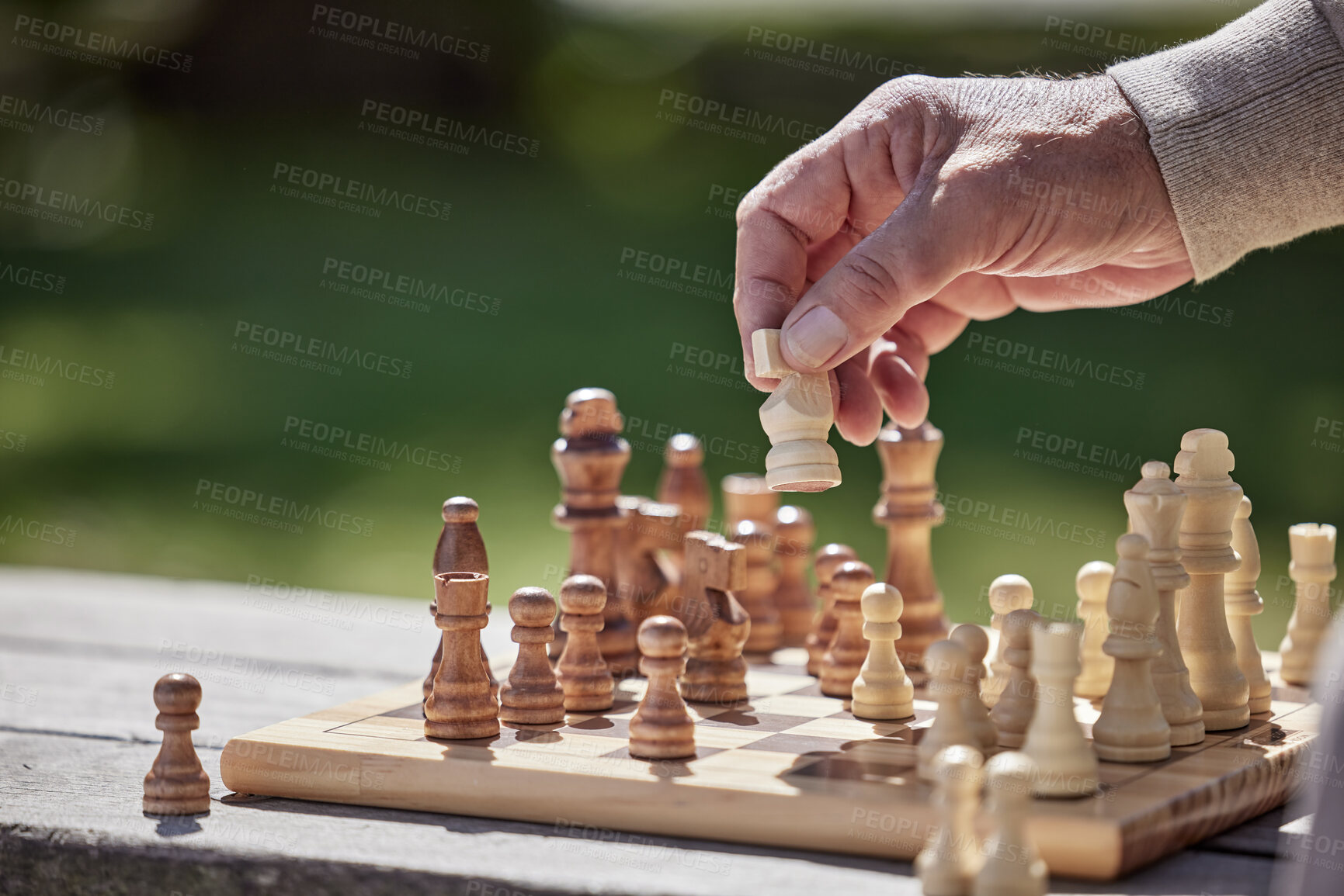 Buy stock photo Hands, man and playing chess game in outdoor with strategy planning, problem solving and choice for competition. Senior person, knight and brain knowledge, battle and learning for sports tournament