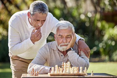 Buy stock photo Together, elderly men and thinking for chess in garden with retirement, friends and strategy or idea in nature. People, social and diversity in countryside for senior man and board game in park