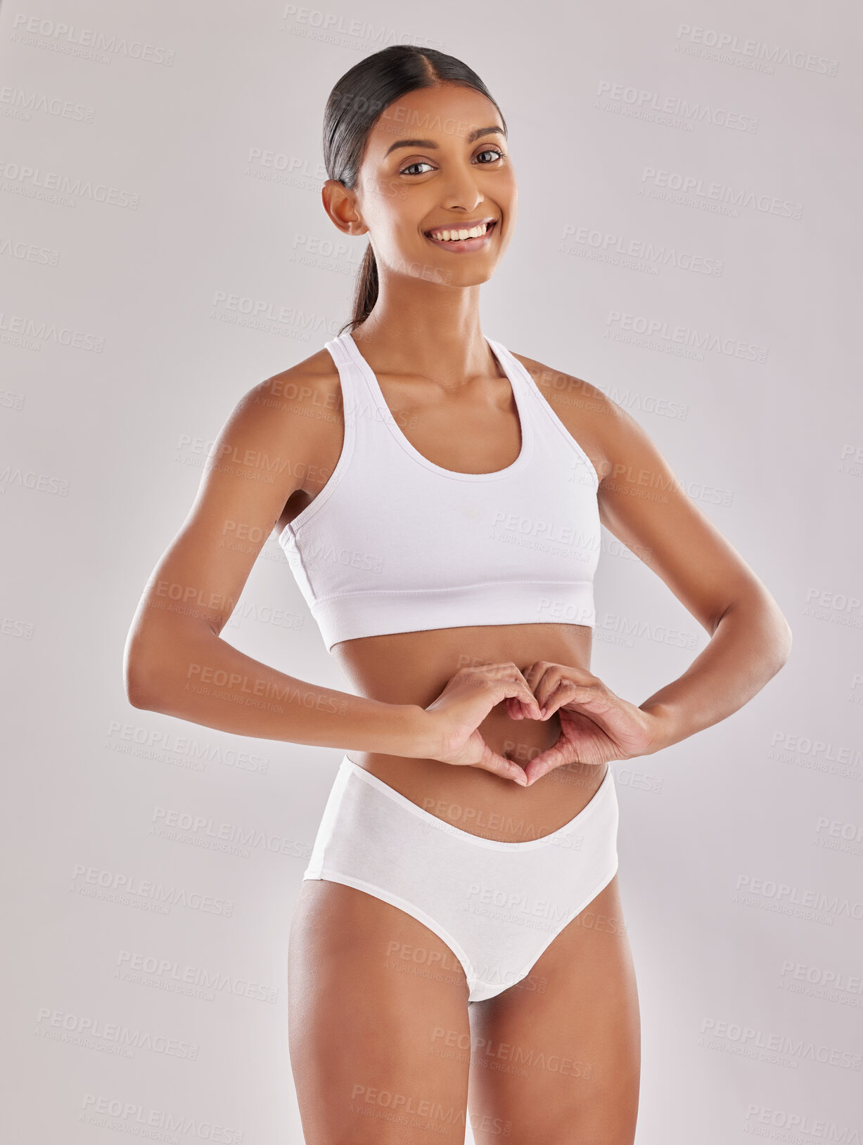 Buy stock photo Woman in underwear, portrait with heart hands and gut health, self love and fitness on studio background. Gesture, emoji and diet, healthy digestion and happy female model with body and lose weight