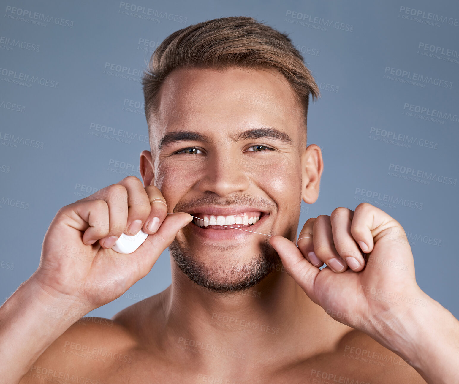 Buy stock photo Dental, portrait and man with floss, mouth care and cavity prevention in orthodontics. Wellness, happy and person on studio background with string, plaque removal and hygiene routine in oral health.