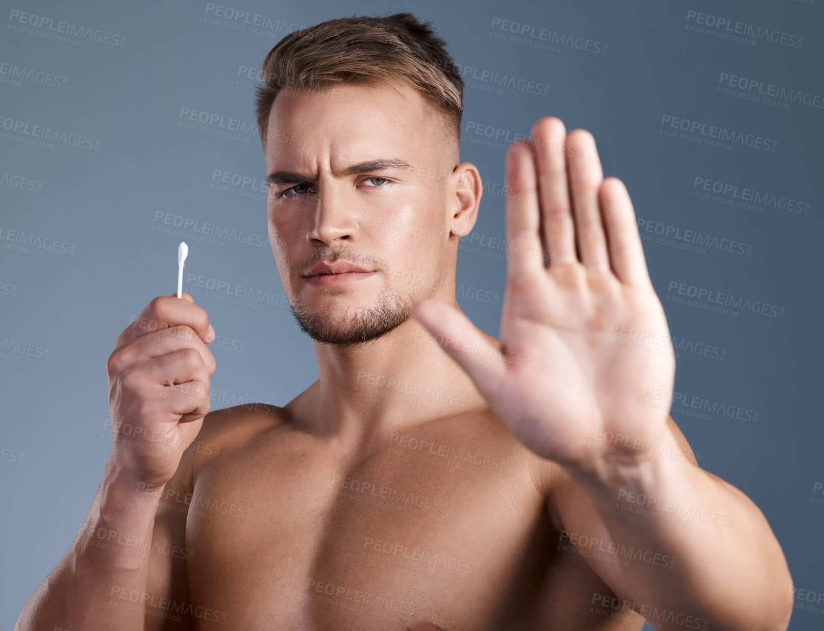 Buy stock photo Stop hand, man and cotton bud for ear cleaning, hygiene warning or cosmetics tool danger. Portrait, no or person with earwax removal product, health caution or prevention on gray background in studio