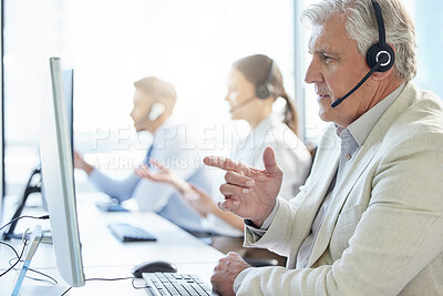 Buy stock photo Mature, man and call center with headphone for conversation and communication in workplace. Group, computer and telemarketing agent or team in office for consulting, customer service and support