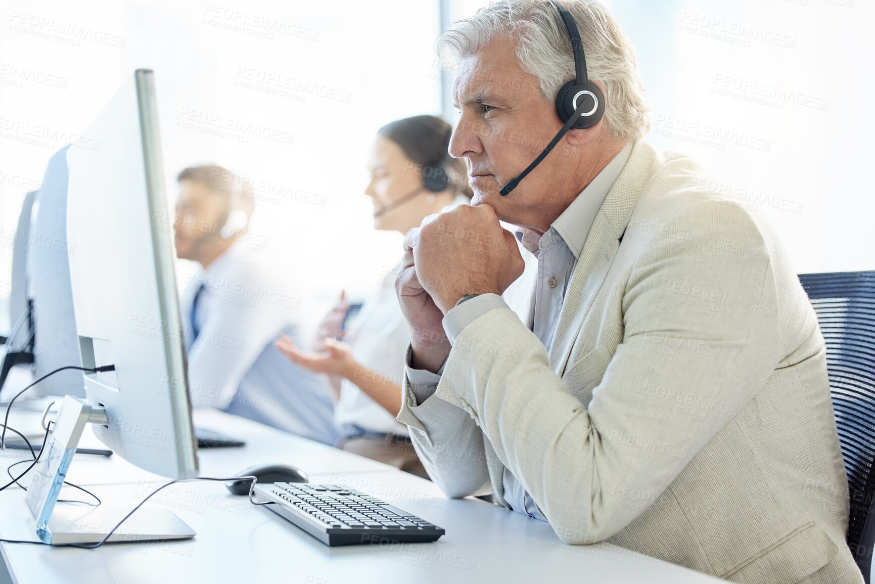 Buy stock photo Call center, mature and man with headphone, conversation and communication in workplace. Team, computer and telemarketing agent or team in office for consulting, customer service and support or help