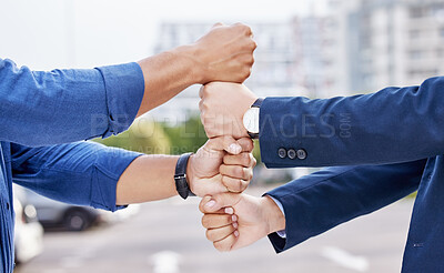 Buy stock photo Shot of two unrecognizable businesspeople stacking their fists outside