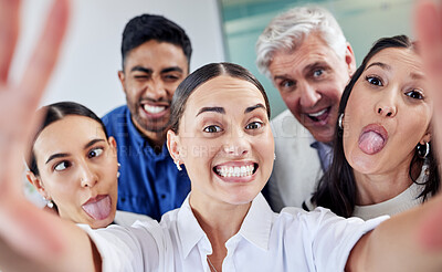 Buy stock photo Shot of a group of businesspeople taking a selfie at work