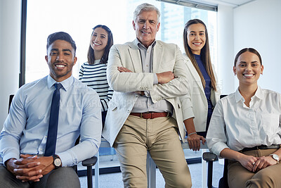 Buy stock photo Shot of a group of businesspeople posing together in an office