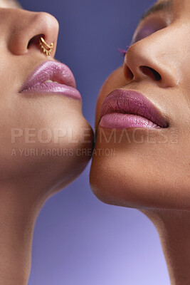 Buy stock photo Cropped shot of two young women wearing purple make-up