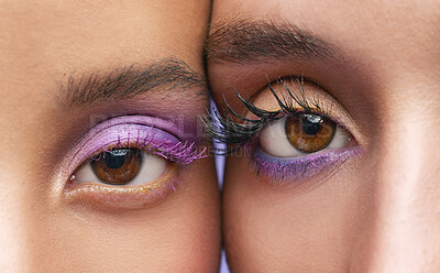 Buy stock photo Cropped shot of two young women wearing purple make-up