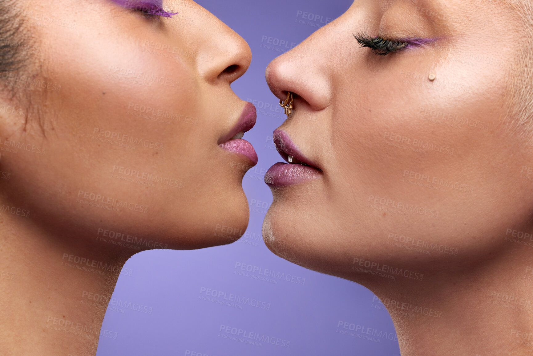 Buy stock photo Cropped shot of two young women wearing purple make-up