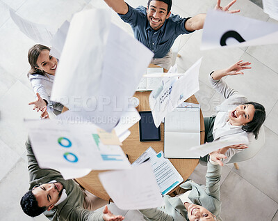Buy stock photo Aerial shot of a diverse group of businesspeople throwing paperwork in the air in celebration while in the office