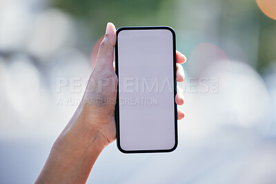 Buy stock photo Shot of an unrecognizable businessman using a smartphone outside