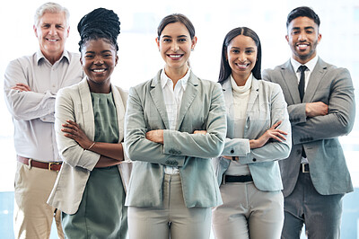 Buy stock photo Cropped portrait of a diverse group of corporate businesspeople standing with their arms folded in the office