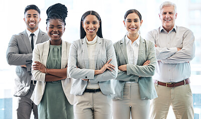 Buy stock photo Cropped portrait of a diverse group of corporate businesspeople standing with their arms folded in the office