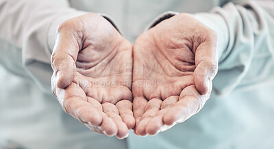 Buy stock photo Cropped shot of an unrecognizable businessman standing with his hands cupped in the office