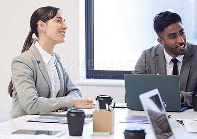 Buy stock photo Shot of two businesspeople having a meeting in a boardroom