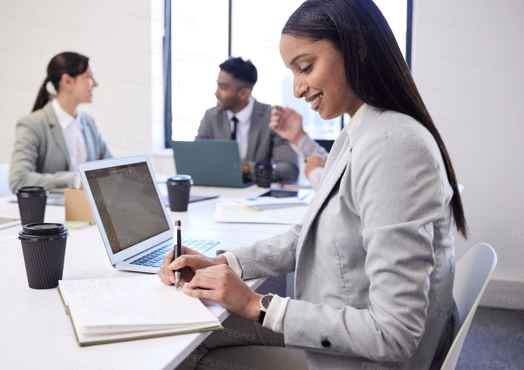 Buy stock photo Happy, business woman and writing with book in meeting for collaboration, minutes or review at office. Female person, secretary or people taking notes for group discussion in teamwork at workplace