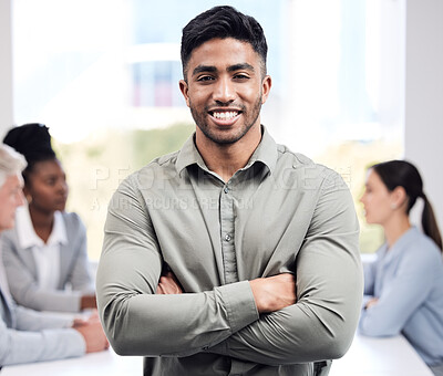 Buy stock photo Portrait, smile and a business man arms crossed in the boardroom with his team planning in the background. Leadership, workshop and confidence with a happy young male employee standing in the office