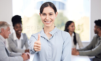 Buy stock photo Portrait, smile and a business woman thumbs up in the boardroom with her team planning in the background. Leadership, workshop and support with a happy young female employee standing in the office