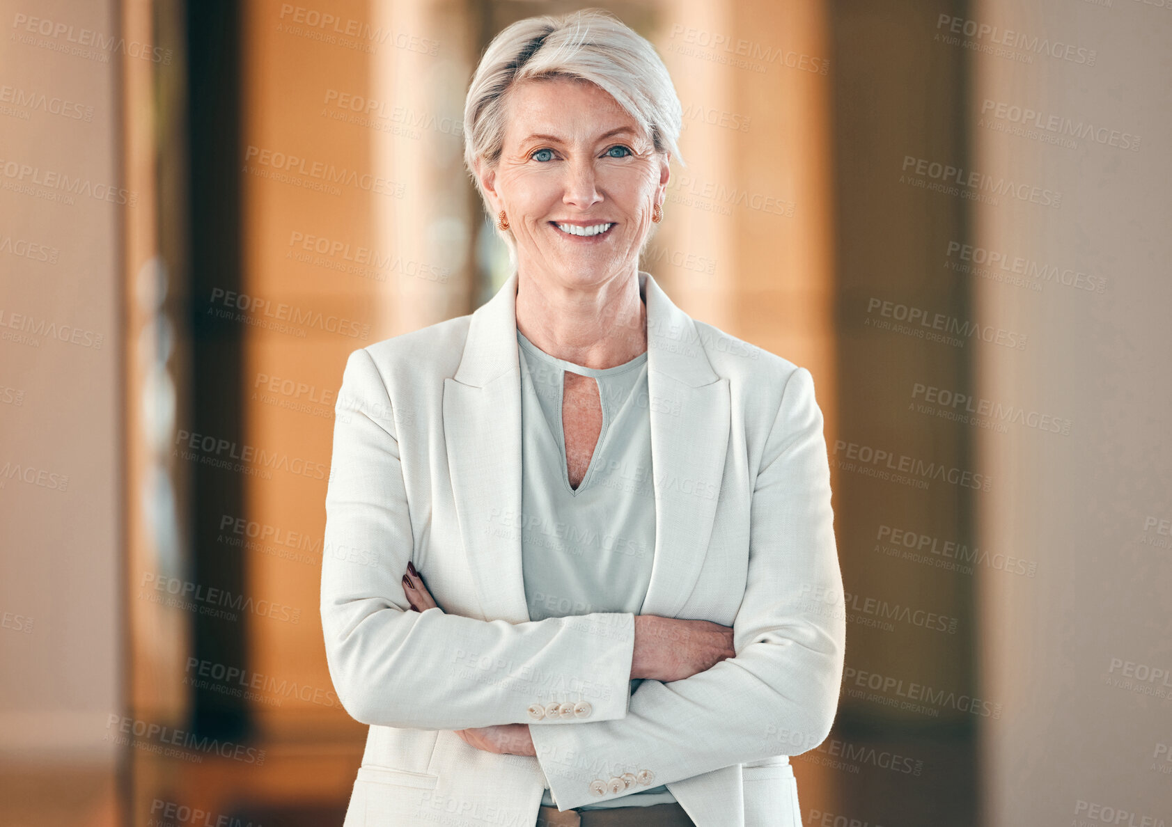 Buy stock photo Portrait, smile and arms crossed with a senior business woman in her corporate workplace. Happy, vision and leadership with a happy mature female manager standing in her office wearing a power suit