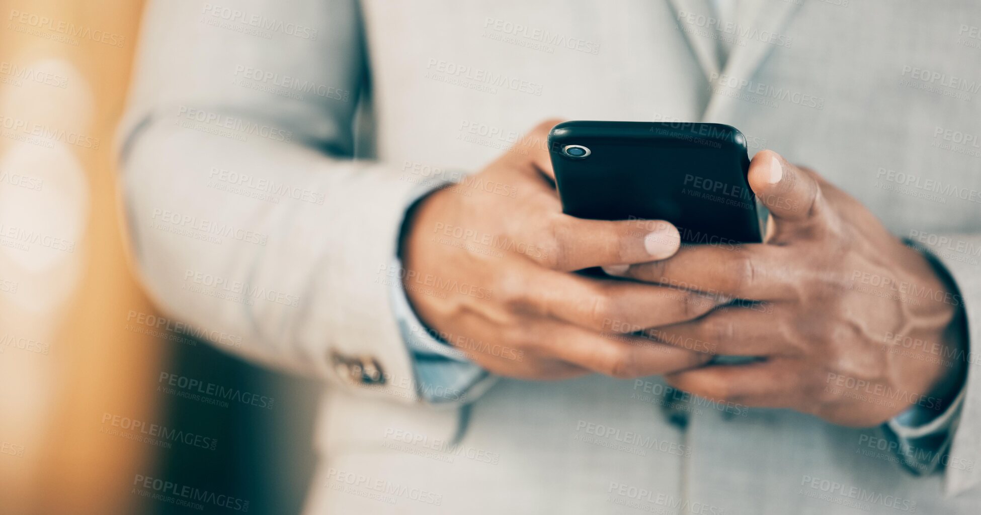 Buy stock photo Shot of an unrecognizable businessperson using a phone at work