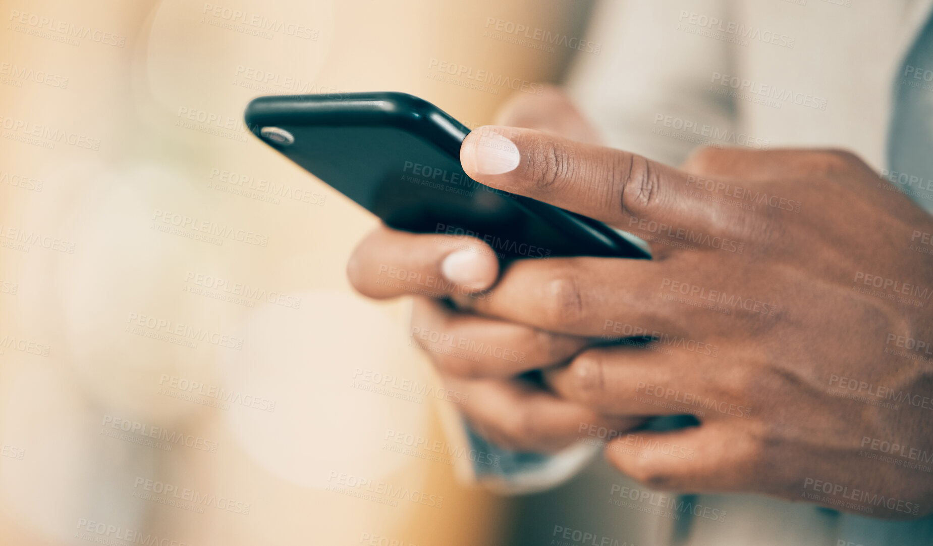 Buy stock photo Shot of an unrecognizable businessperson using a phone at work